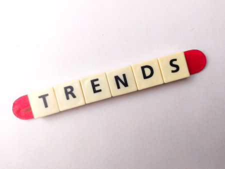 Toys word with the word TRENDS on a white background. Business concept.の写真素材