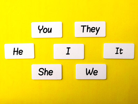 Personal pronouns English grammar basics notes on a yellow background. Education and languages concept.の写真素材