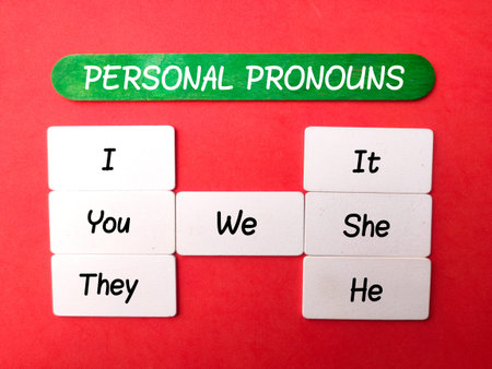 Personal pronouns English grammar exercise on a red background. Languages conceptの写真素材