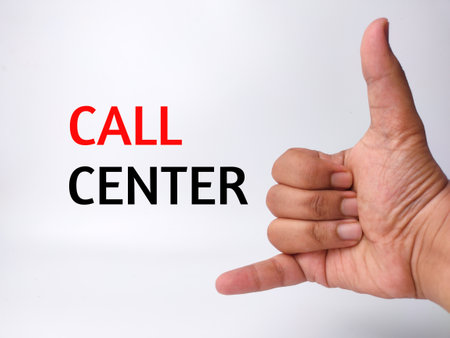 Someone hand action like phone with the word CALL CENTER on white backgroundの写真素材