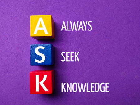 Colored cube with the word ASK Always Seek Knowledge on purple background