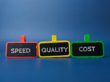 Colored wooden board with the word SPEED QUALITY COST on blue backgroundの写真素材