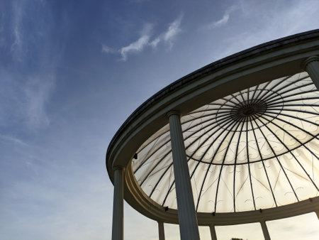Beautiful atmosphere in the morning with large white gazebo at recreational parkの写真素材