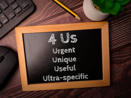 Black board and pencil with the word 4 Us on a wooden background. Copywriting formula concept.の写真素材