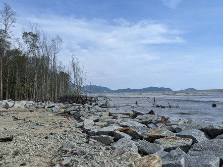 The atmosphere from the beach is beautiful with strong waves and big rocks on the beach