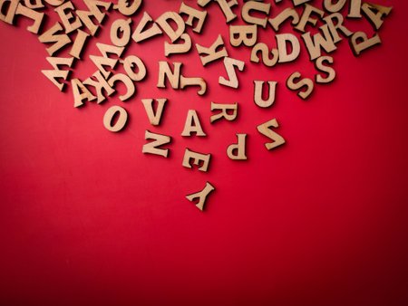 Top view wooden word on a red backgroundの写真素材