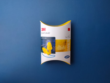 Lumut, Perak - June 30 2023 : Top view a box of ear plugs from the 3M brand on a blue background.のeditorial素材