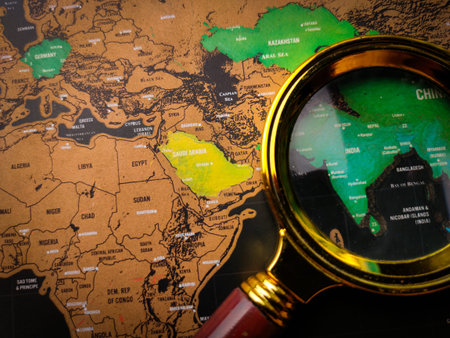 Top view vintage magnifying glass and world map focus to SAUDI ARABIA map