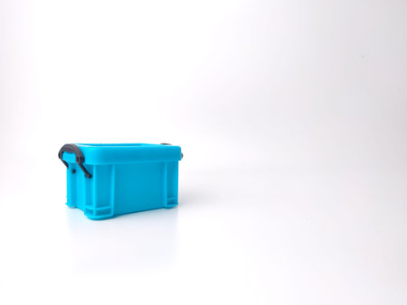 Blue miniature storage basket box model living room on a white background with copy space.