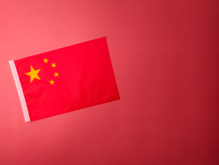 Top view china flag on a red background with copy and text space.の写真素材