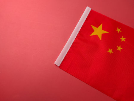 Closeup china flag on a red background.の写真素材