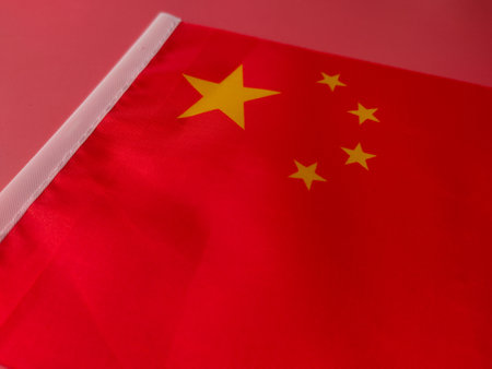 Closeup china flag on a red background.の写真素材