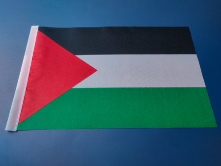 Closeup palestine flag on a blue background.の写真素材