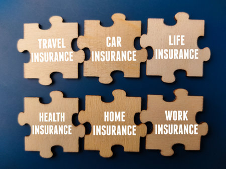 Top view wooden puzzle with insurance concept on a blue background. Business and insurance concept.の写真素材