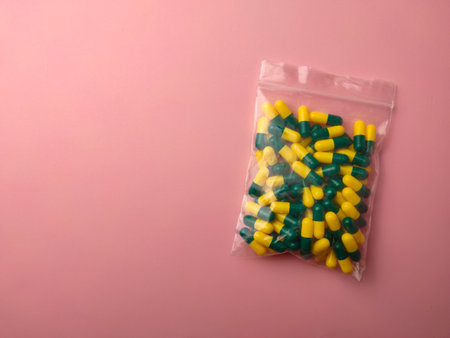Top view of a medicine pill package on a pink background with copy space.の写真素材