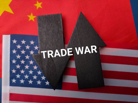 Us america and china flag with the word TRADE WAR on a black wooden arrow.の写真素材
