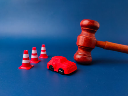 The image is a conceptual representation of a car accident lawsuit or legal proceedings related to a motor vehicle incident.の写真素材