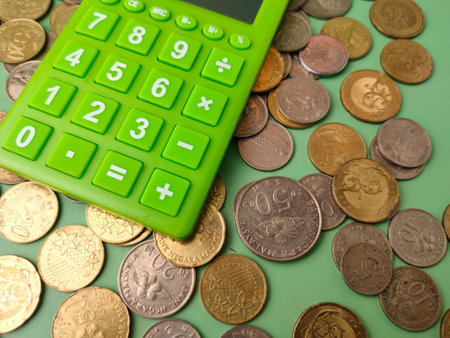 The combination of a calculator and money symbolizes financial management, savings, or investment.の写真素材