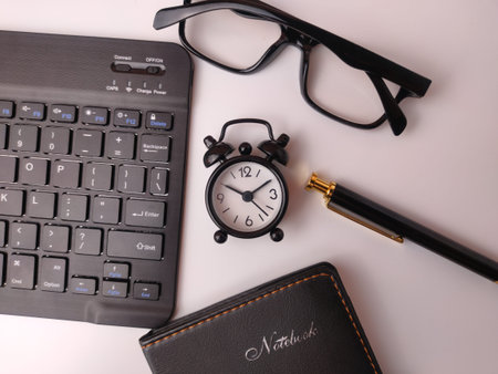 The image displays a collection of office items arranged as a flat lay on a white background.