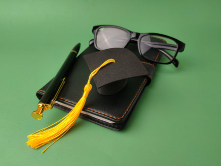 The image displays objects symbolizing academic achievement and education.