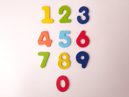 Colorful wooden or foam number manipulatives, likely part of a puzzle or learning set.