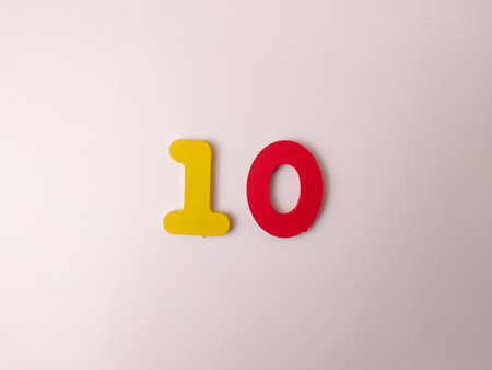 The image displays the numeralÂ 10Â as two separate figures, a yellow 1 and a red 0.の写真素材