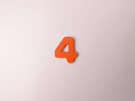 The image shows an orange, stylized number 4 on a white background.の写真素材
