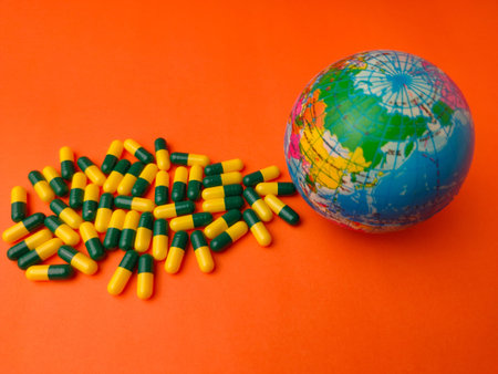 This image is a conceptual representation of global healthcare, showcasing a small globe alongside a...
