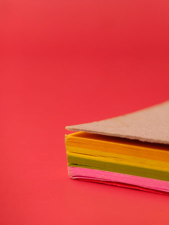 Closeup of a neon-colored sticky notes, often used for reminders and organization.