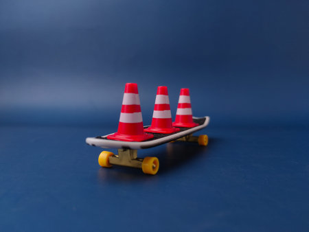 The item shown is a miniature finger skateboard with three small traffic cones.