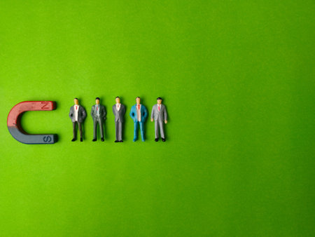 Business and leadership concept where a magnet symbolizes the attraction of talent or customers.