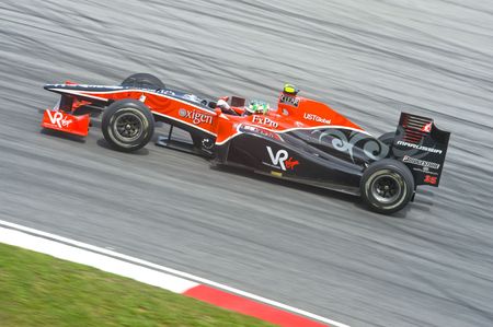 Photo for Sepang F1 Circuit, Malaysia - April 2, 2010 – Lucas di Grassi of  Virgin-Cosworth formula one racing team practicing during Petronas Malaysian Grand Prix 2010 April 2-4, Sepang.  - Royalty Free Image