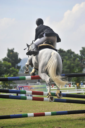 Putrajaya, Malaysia - May 15th, 2010 - A competitor performing in show jumping competition during Premier Cup 2010のeditorial素材