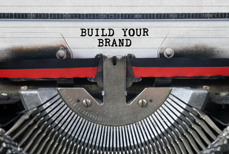 BUILD YOUR BRAND Typed Words On a Vintage Typewriter Conceptualの写真素材