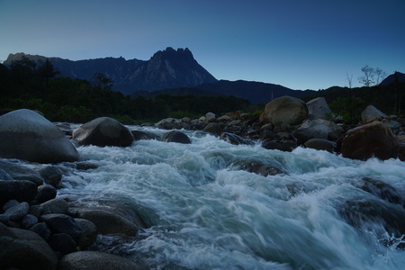 Beautiful Shallow Rapid River With Mount Kinabalu In Backgroundの写真素材