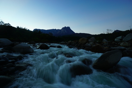 A peaceful morning view at Borneo river with Mount Kinabalu backgroundの写真素材