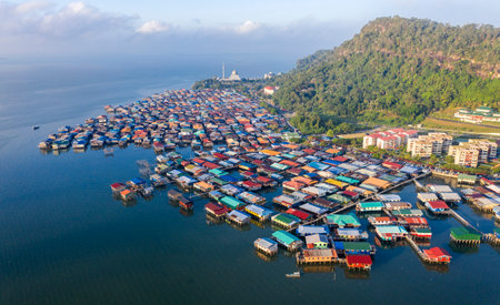 aerial drone image of local water village houses at Kg. Sim Sim water village Sandakan City, Sabah, Malaysia. Sandakan once known as Little Hong Kong of Borneo.の写真素材