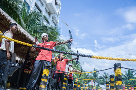 Selangor, Malaysia - October 31, 2015 â€“ People enjoy playing archery in carnival open day in...
