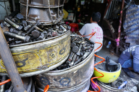Bangkok, Thailand. Mar 30, 2015. Cleanliness is very important. If you let kids make a total mess in kitchen and then leave, you are not really teaching them anything. Old bolts and nuts at workshop.のeditorial素材