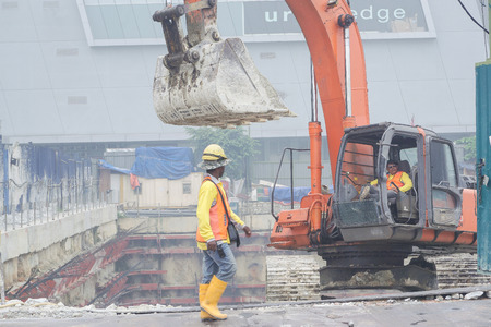 Kuala Lumpur, Malaysia â Oct 3, 2015. Construction work is a dangerous land-based job. Many hazardous task and conditions such as working with height, excavation, noise, dust and power tools.のeditorial素材