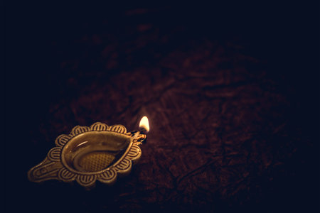 Diwali traditional diya lamp on floor background