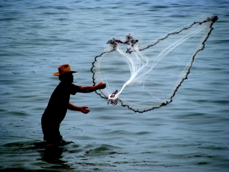 Fisherman in actionの写真素材
