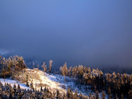 hills covered with snow in central switzerlandの写真素材