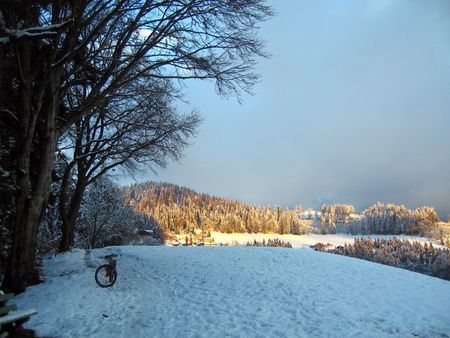 hills covered with snow in central switzerlandの写真素材