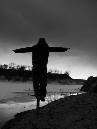 making a balance by the frozen lakeの写真素材