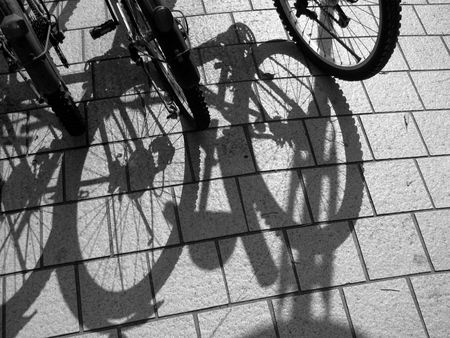 bicycles wheels and their reflectionの写真素材