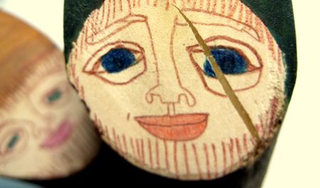 a face drawn on a piece of woodの写真素材