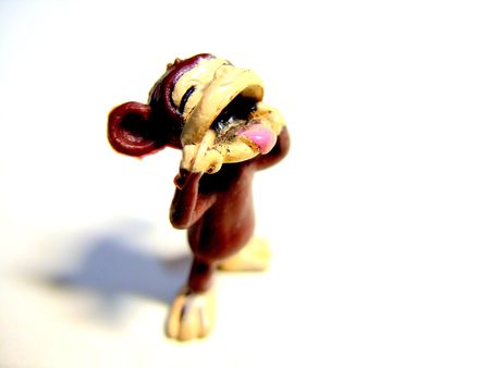 a toy monkey standing with his tongue outの写真素材