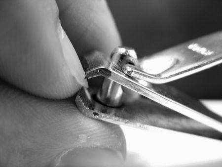 cutting nails with a nail clipperの写真素材