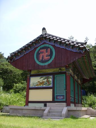 a traditional building with buddhist symbol in a temple in koreaの写真素材